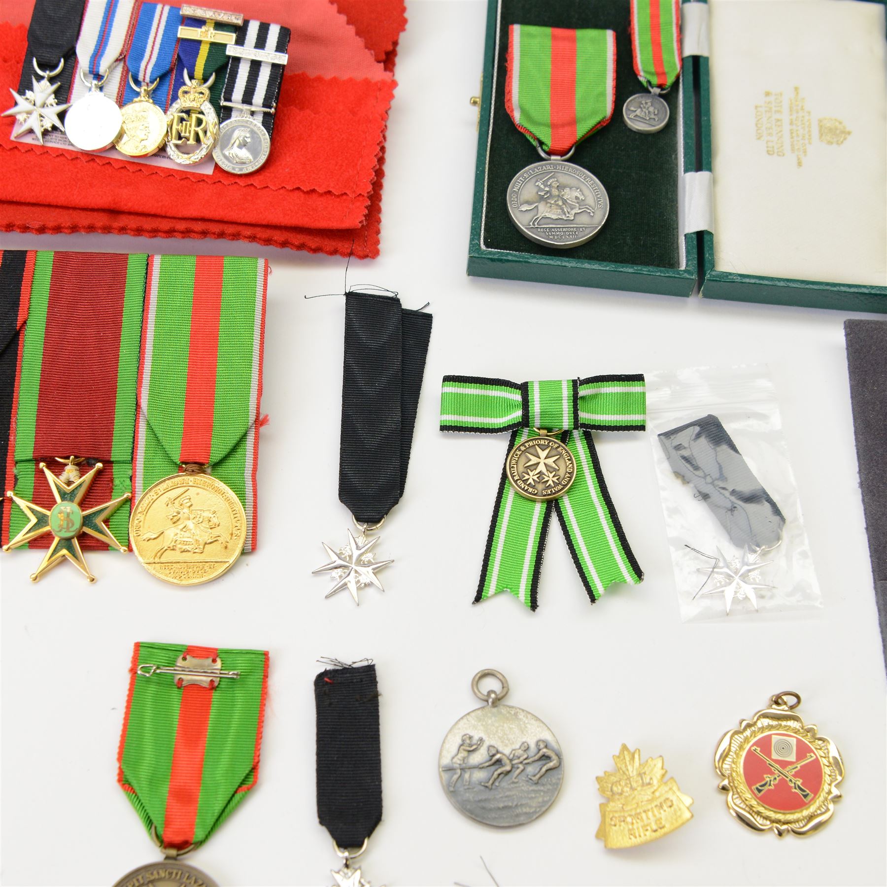 Collection of medals, insignias and minitures, including American National Defence medals, Efficiency Decoration medal, Order of St. John of Jerusalem stars, Military and Hospitaller Order of St. Lazarus of Jerusalem medals etc, several by Toye, Kedding & Spencer Ltd and Worcestershire Medal Service Ltd