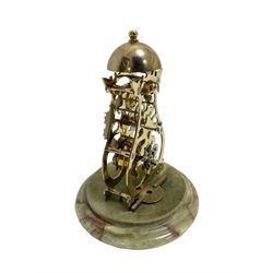 Thwaites & Reed - Small 20th century skeleton clock with a glass dome and stepped onyx base,  pierced movement frames with a silver chapter ring, Roman numerals, minute markers, and steel hands, domed brass bell with passing strike on the hour, with a lever platform escapement, wound and set from the rear. With key.