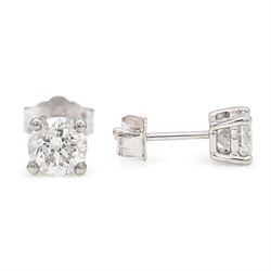 Pair of platinum diamond earrings, each stud set with a single round brilliant cut diamond, stamped PT 950total diamond weight approx 1.05 carat