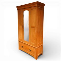 Edwardian ash single wardrobe, the moulded cornice above a single mirrored  hanging interior, flanked by panelled sections with drawer below, raised on bracket feet