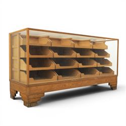 Dudley & Co - early 20th century oak framed and glazed haberdashery shop counter, fitted w...
