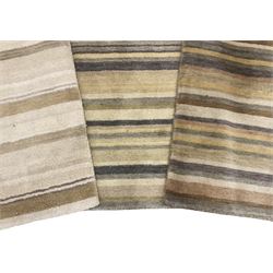 Three contemporary striped rugs in green, brown and grey shades 