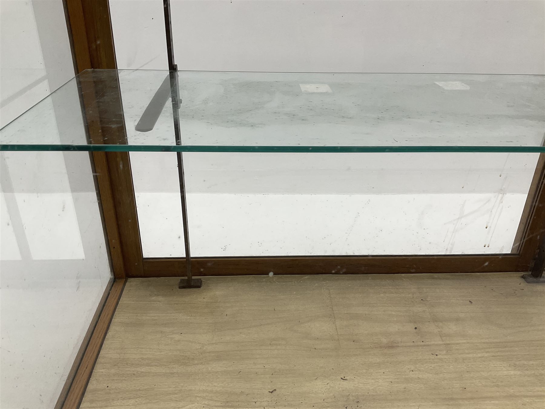 Mid century oak framed glazed display counter, two sliding doors, glazed shelves W182cm, H91cm, D61cm