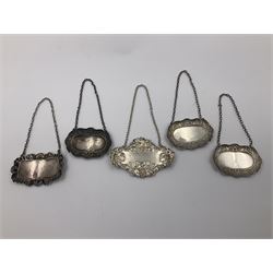 Five modern silver decanter labels, to include three similar Sherry and Brandy examples embossed with scrolls, two hallmarked C Robathan & Son, Birmingham 1989, and one hallmarked Laurence R Watson & Co, Birmingham 1987, together with a scotch example, hallmarked A Marston & Co, Birmingham 1970, and a larger sherry example, embossed with fruiting vines, hallmarked A Marston & Co, Birmingham 1993