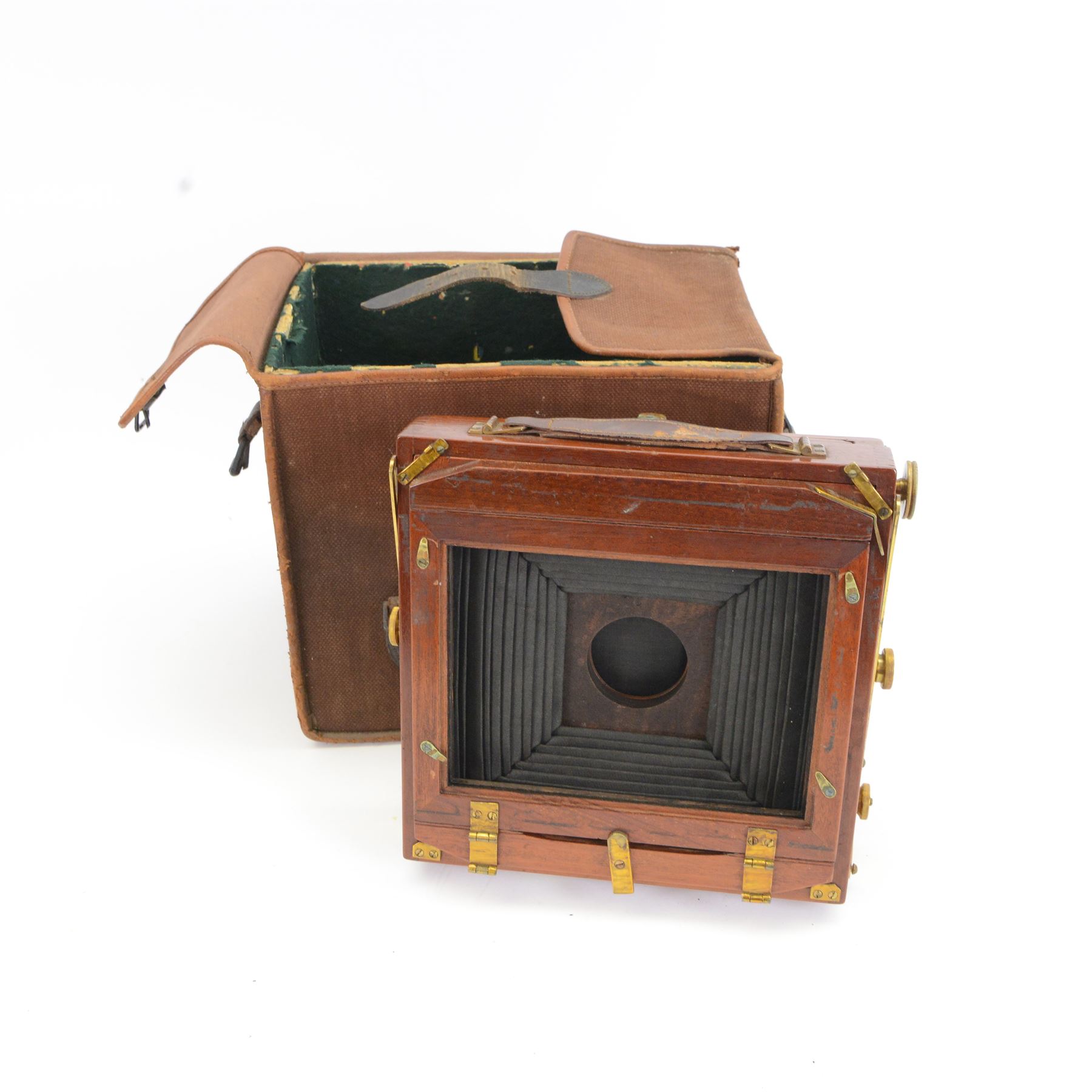 UNABLE TO SELL Two mahogany and brass half plate cameras, comprising E & T Underwood camera and a Taylor's Drug Co. Ltd 'The Albion' camera, each with Thornton Pickard 'Snap Shot' lenses, all with ivory maker's plaques, with a glass plate and a canvas carry case