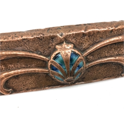  Art Nouveau period beaten and embossed copper fire fender with central Ruskin style cabochon decoration, L138cm x W39cm   