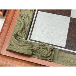 Danbury Mint 'The Fantasy of the Crystal' chess set consisting of mythical pewter chess pieces within a wooden case with chess board lid, together with 16 additional chess pieces in a wooden display case.