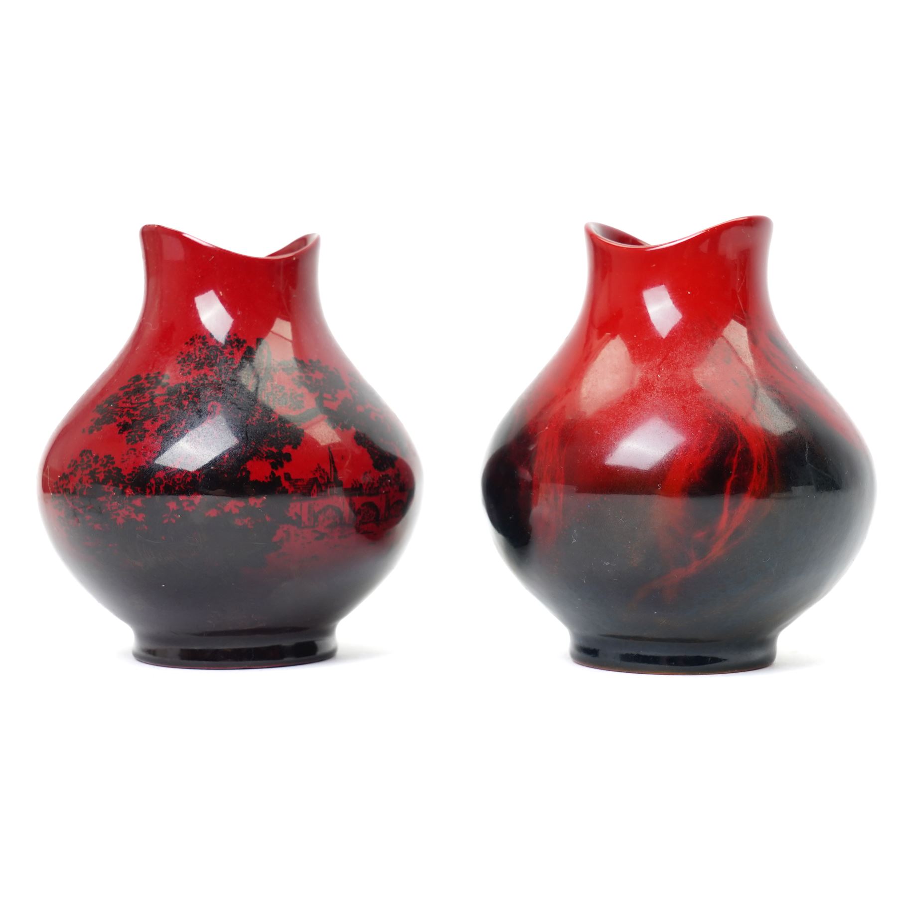 Royal Doulton flambe vase decorated with a rural landscape H17cm, another 'Veined' H11cm and another 'Woodcut' H11cm (3)