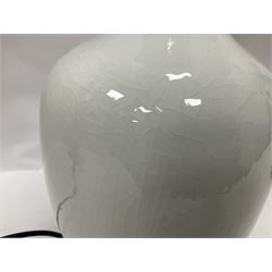 Pair of Chinese ivory crackle glazed table lamps, each of bottle form, raised upon circular hardwood base, excluding fittings H43cm