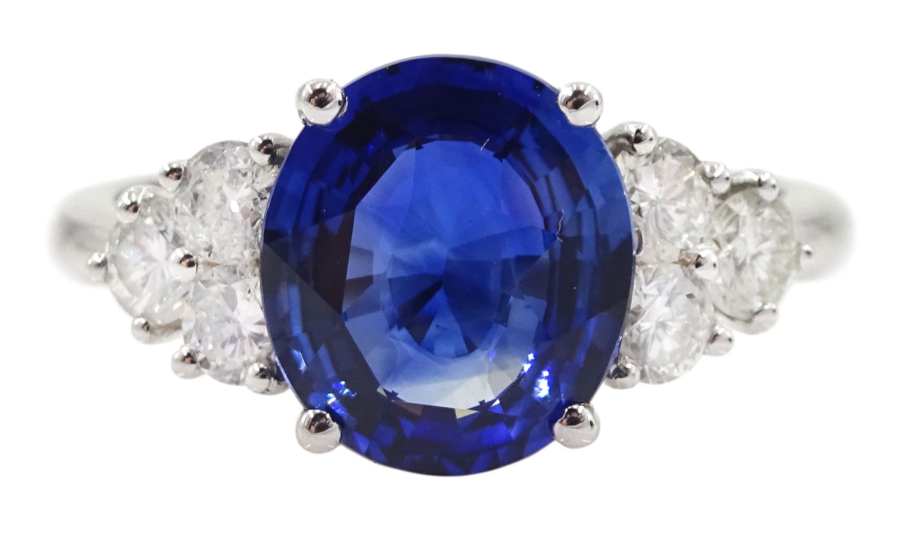 18ct white gold fine oval Ceylon sapphire and six round brilliant cut diamond ring, hallmarked, sapphire approx 2.50 carat, total diamond weight approx 0.50 carat