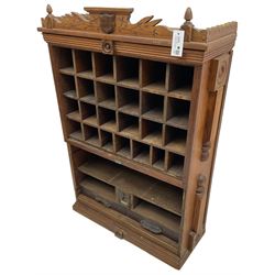 19th century stained pitch pine 'US Mail' pigeonhole unit, raised carved gallery with applied inscribed shield plaque, fitted with twenty five pigeon holes over shelves and correspondence drawers