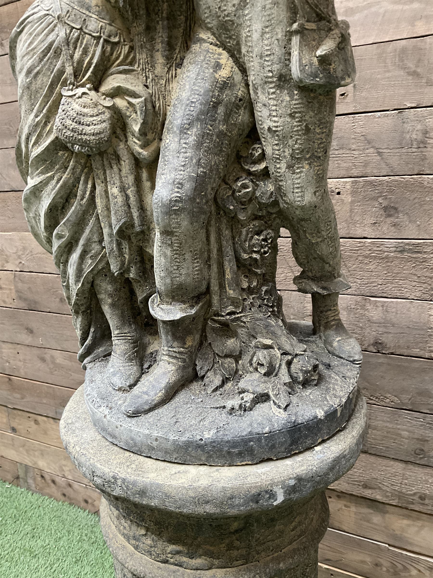 Romeo & Juliet - cast stone garden figure raised on circular fluted column - THIS LOT IS TO BE COLLECTED BY APPOINTMENT FROM DUGGLEBY STORAGE, GREAT HILL, EASTFIELD, SCARBOROUGH, YO11 3TX