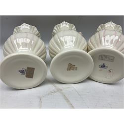 Five late 19th/early 20th century and later Belleek vases, comprising pair of Lotus Blossom examples, shamrock tree trunk vase, twin handled shamrock vase and a baluster form vase decorated with applied roses, all with printed marks beneath, tallest H16cm