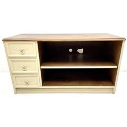 Cream painted television stand, single shelf flanked by three drawers