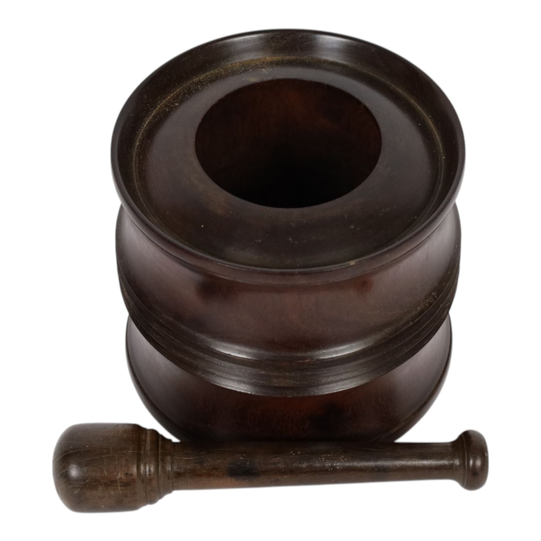 18th century lignum vitae captive mortar and pestle, the mortar of turned waisted form with central reeded girdle, and captive opening with rolled rim, H12.5cm D14cm, and pestle L17.5cm