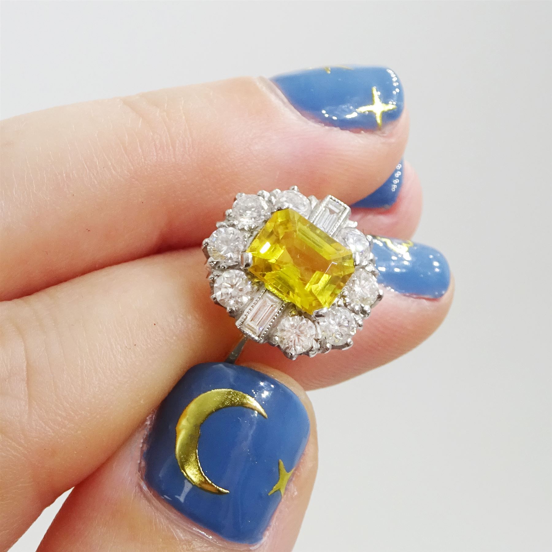 18ct gold yellow sapphire and diamond cluster ring, single octagonal cut yellow sapphire of approx 2.15 carat, surrounded by eight brilliant cut diamonds and two baguette cut diamonds within a milgrain setting, stamped, total diamond weight 1.2 carat