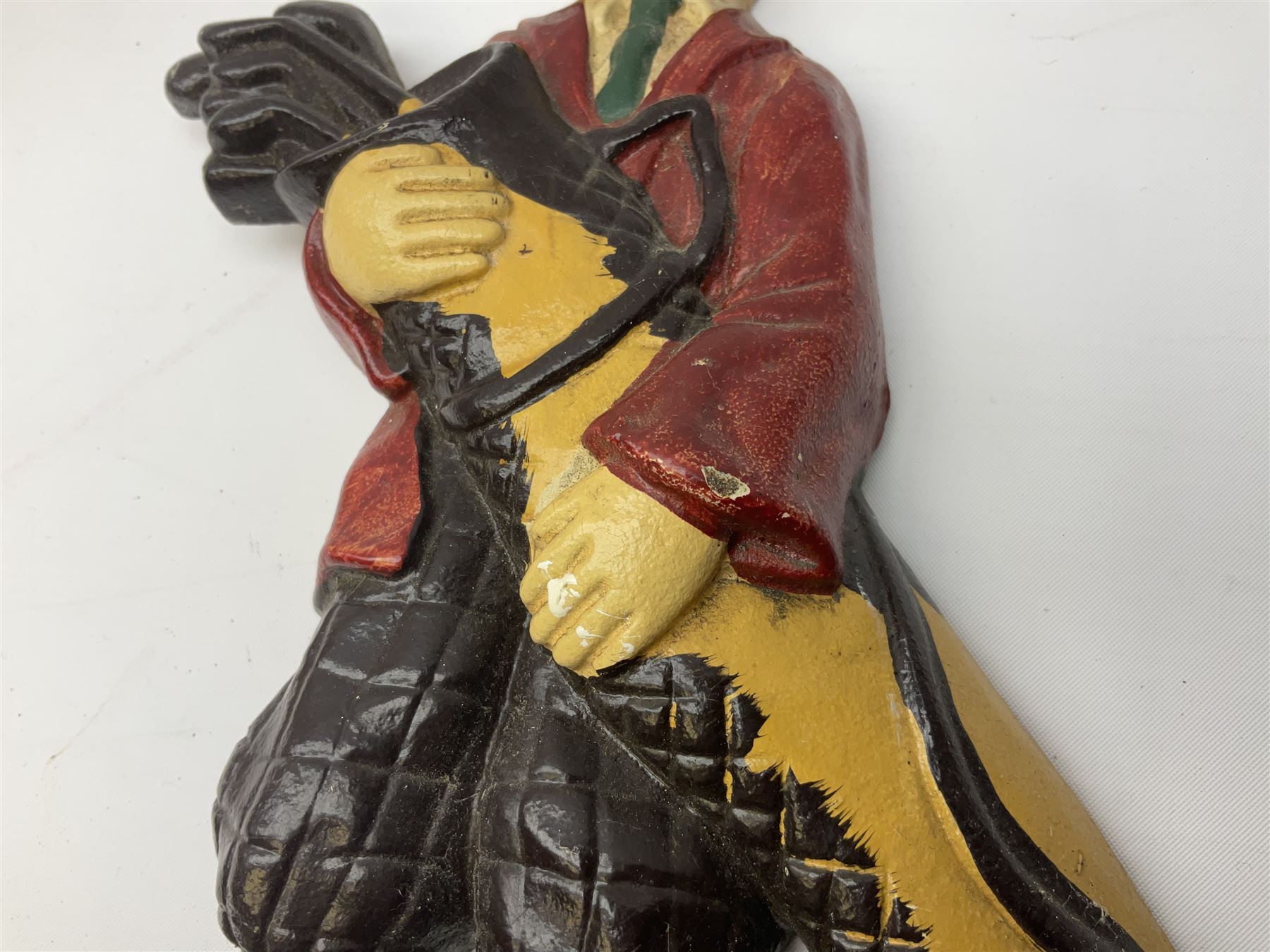 Pair of cast iron Dulux Old English sheepdog doorstops together with another modelled as a golfer