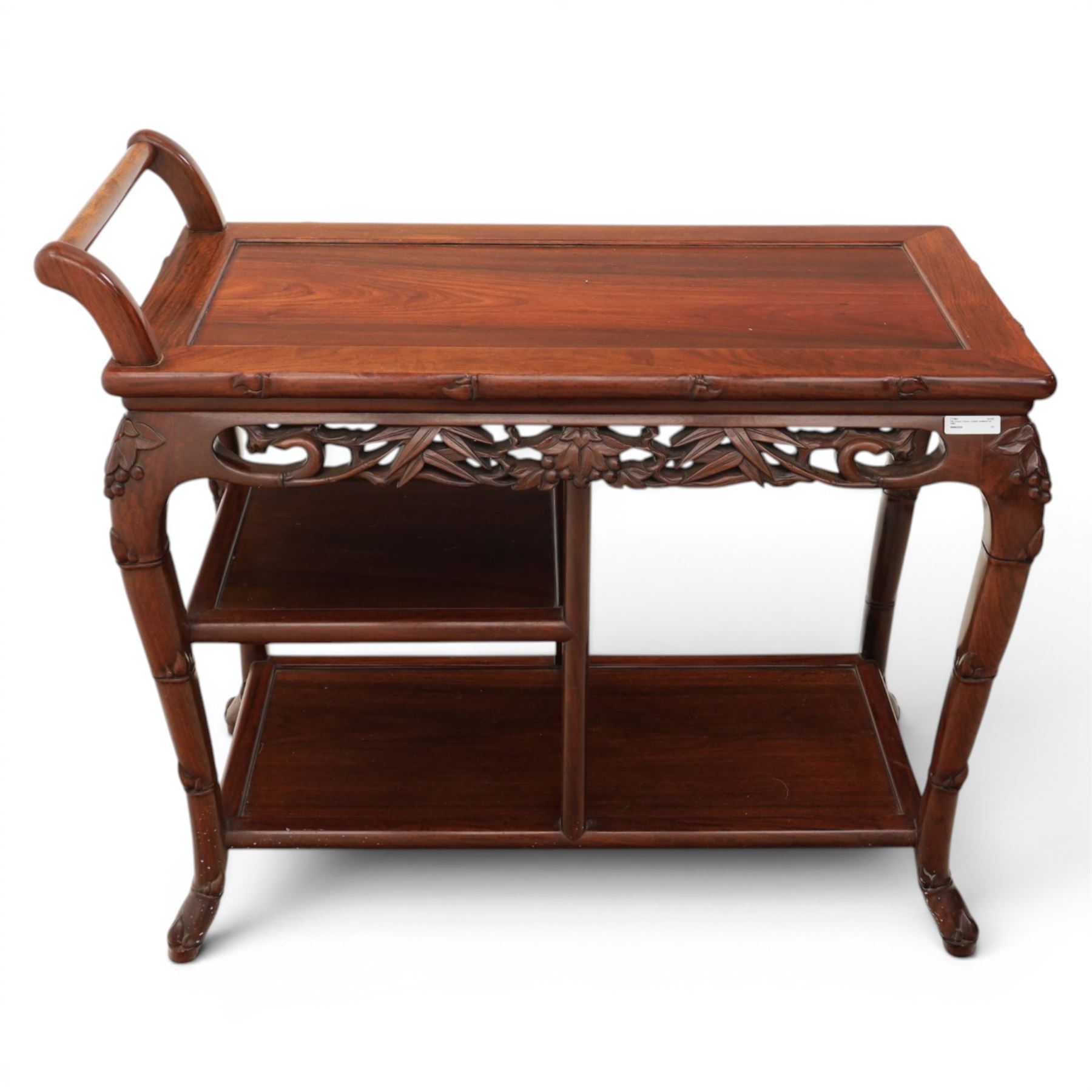 20th century Chinese ornately hardwood tea trolley, rectangular top with handle, pierced frieze above a half shelf above a full length undertier, raised on shaped supports