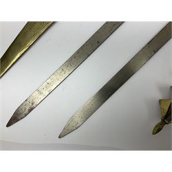 Near pair of short swords each with slightly curving 41cm fullered steel blade and all brass H-shaped hilt L52cm overall; plaited black leather whip; and reproduction pair of brass hilted swords, brass halberd blade and mace (7)