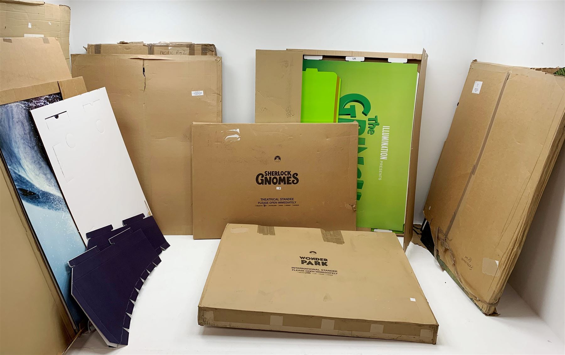 Approximately nine promotional standees / cardboard cut-outs for various films including 'The Meg', 'Jumanji Welcome to the Jungle', 'The Kid Who Would Be King', 'The Grinch', 'Abominable', 'Pacific Rim 2', 'Sherlock Gnomes', 'Wonder Park' etc