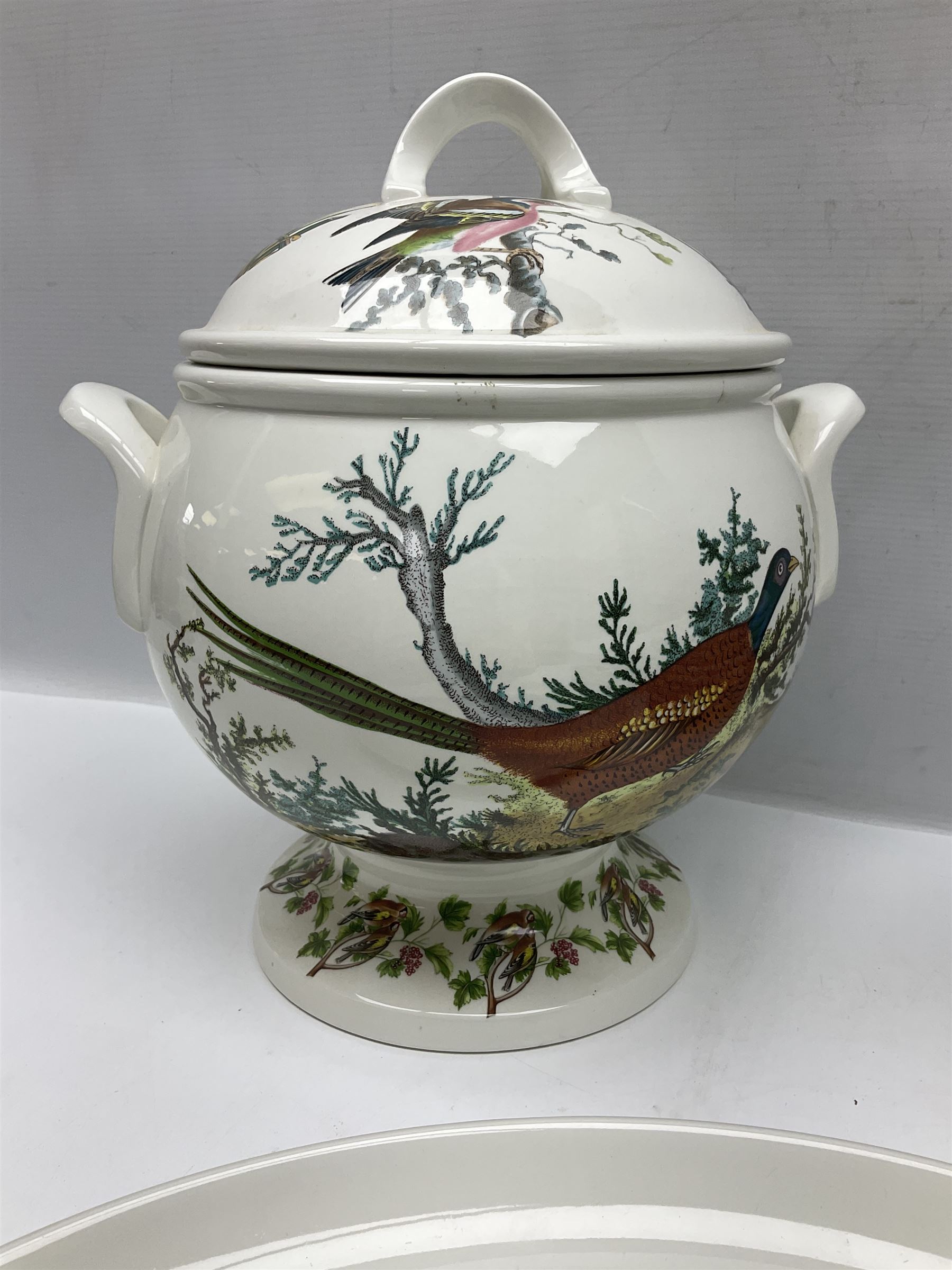 Portmeirion Birds of Britain pattern, dinner service for eight, to include covered soup tureen with ladle, dinner plates, soup bowls, side plates, oval plates, a serving platter, two oval serving dishes, salt and pepper, etc and eight shell dishes in the British fish pattern (56) 