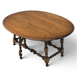 Ercol - elm oval/rectangular drop leaf coffee table, bobbin turned base