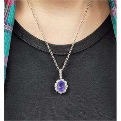 18ct white gold oval tanzanite, round brilliant and marquise cut diamond pendant, stamped 750, on 14ct white gold necklace, stamped 585, tanzanite approx 10.30 carat, total diamond weight approx 1.40 carat