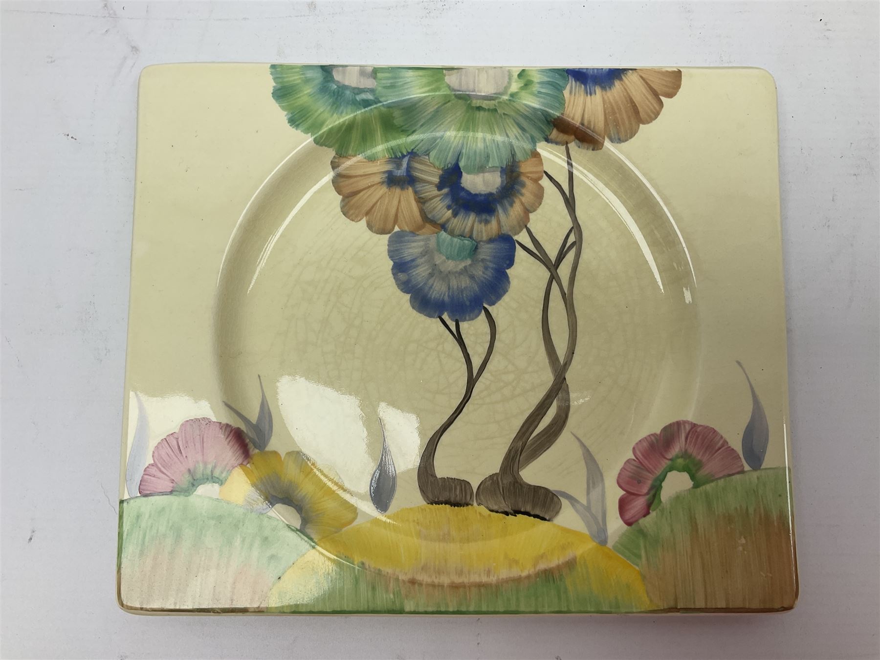 Clarice Cliff Biarritz for Royal Staffordshire/Wilkinson Ltd, teacup, saucer and side plate, in Viscaria pattern, the plate and saucer of rectangular form, each with printed mark beneath