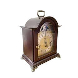 20th century- Hermle 8-day moon phase three train bracket clock, with a brass dial and subsidiary moon dial, floating balance escapement chiming the quarters on 5 gong rods. With an English oak cased Smiths Enfield 8-day striking mantle clock c1950. With pendulum and key.  