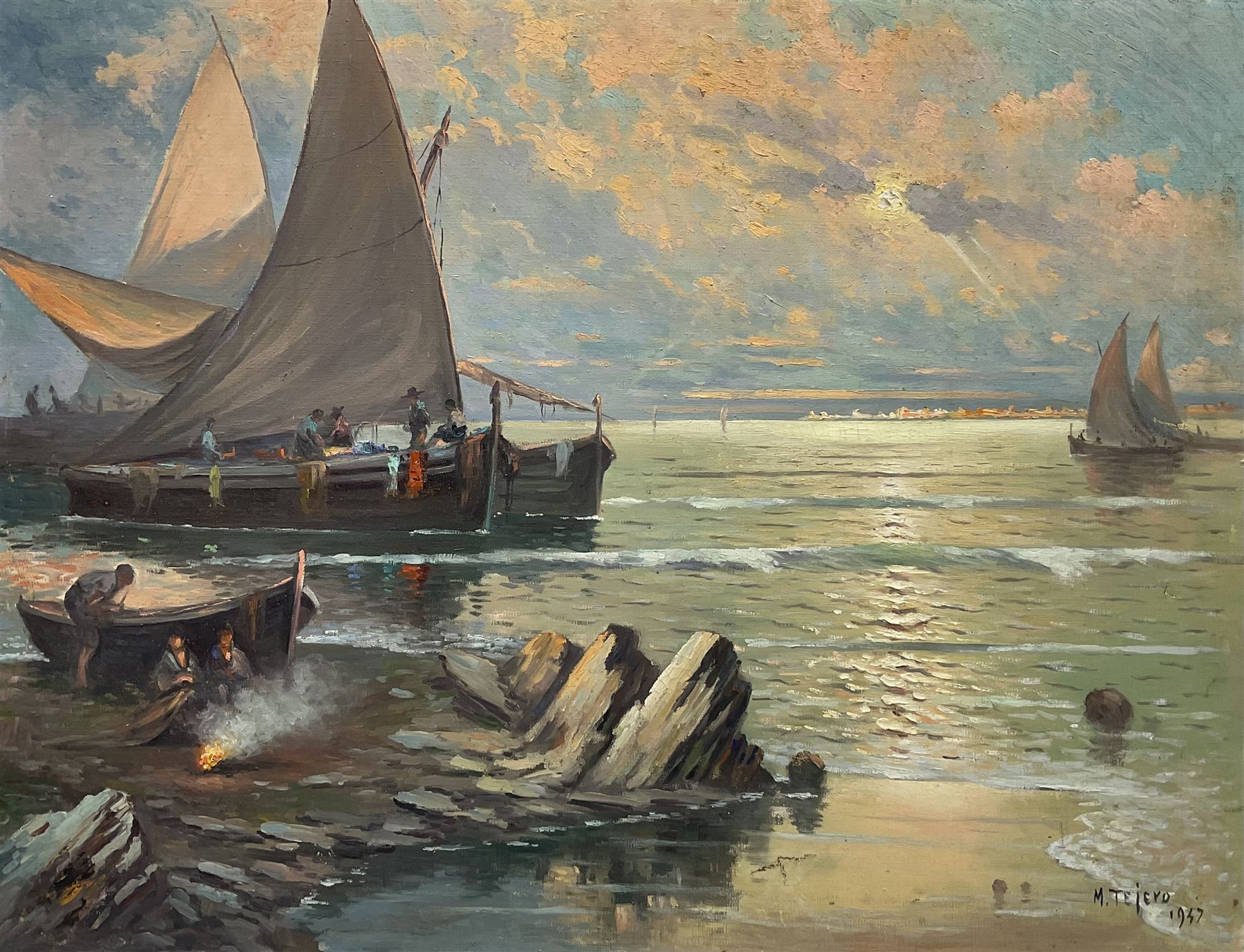 Manuel Tejero (Spanish 19th/20th century): Fishing Boats at Sunset with Campfire on the Shoreline, oil on canvas signed and dated 1937, 65cm x 85cm (unframed)