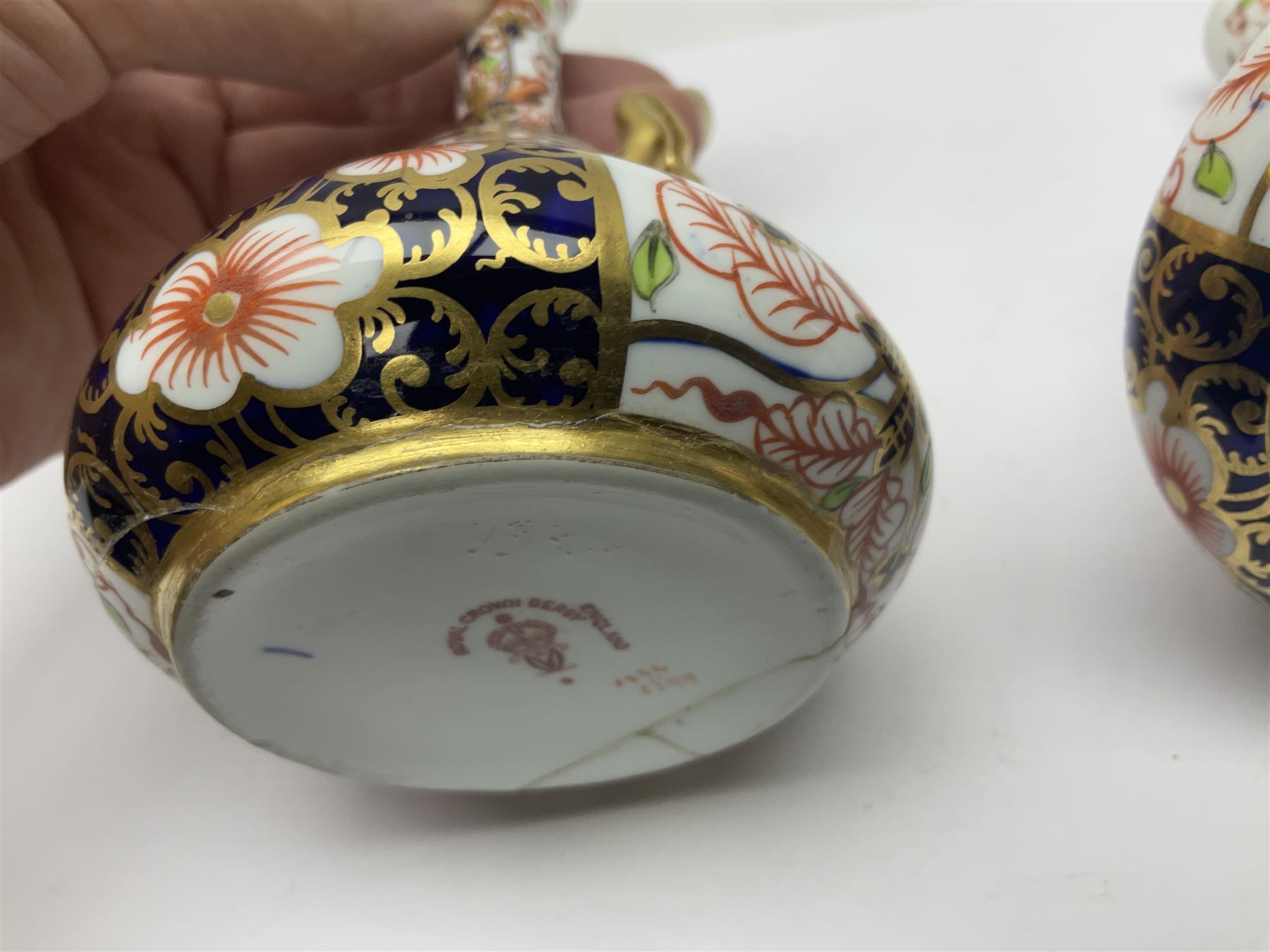 Pair of Royal Crown Derby 6299 imari pattern miniature vases, together with a miniature pitcher and dish in 2451 imari pattern, all with printed marks beneath, vase H12cm 