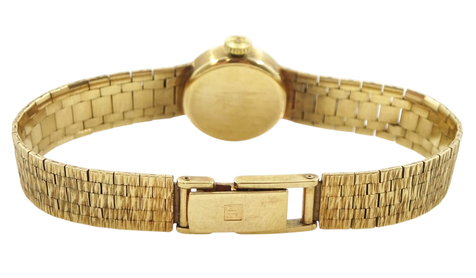 Tissot ladies 9ct gold manual wind wristwatch, silvered dial with baton hour markers, on integral 9ct gold bracelet, London 1972