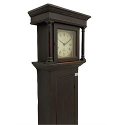 A provincial 30-hour chain driven longcase clock in an oak finished case with a flat top and wide cornice pediment, full length trunk door on a square plinth with applied skirting, an associated 8-1/4” square painted dial with Roman numerals , five-minute Arabic’s and minute markers, fan motif spandrels with non-matching steel hands, dial inscribed “Goodall, Tadcaster” and pinned directly to a 19th century four pillar countwheel movement with a recoil anchor escapement striking the hours on a bell. With pendulum and weight.  
George Goodall (II) is recorded as working in Tadcaster c. 1780-1810.
