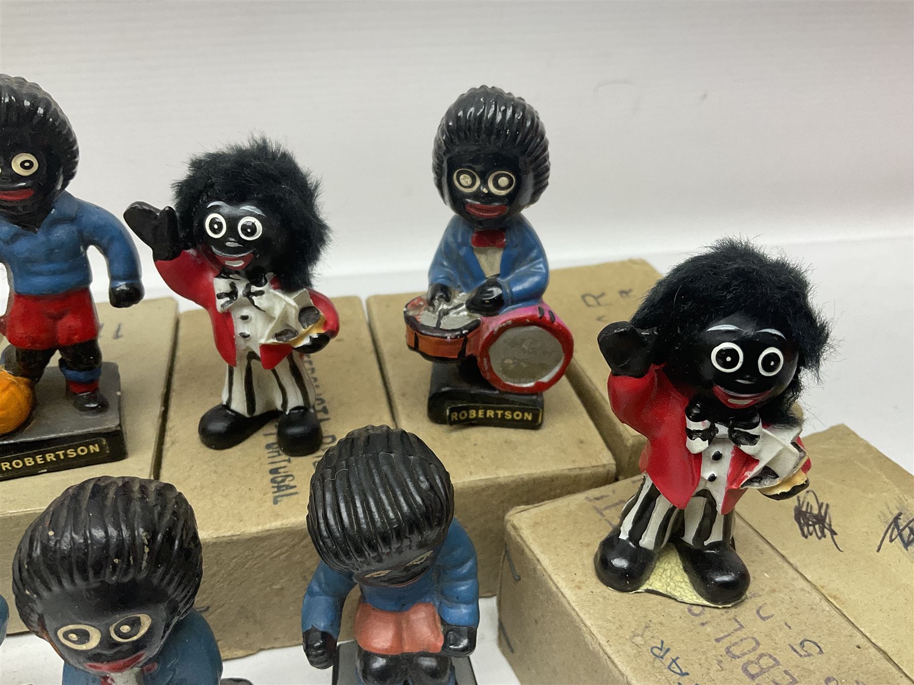 Collection of twenty two Robertson golly figures, H8cm