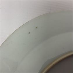 Three 18th century Chinese Famille Rose plates, the first example enamelled with blossoming peonies, rockwork and fence, the other two examples of similar design, decorated with blossoming peonies and sprigs within shaped inner borders, each approximately D23cm