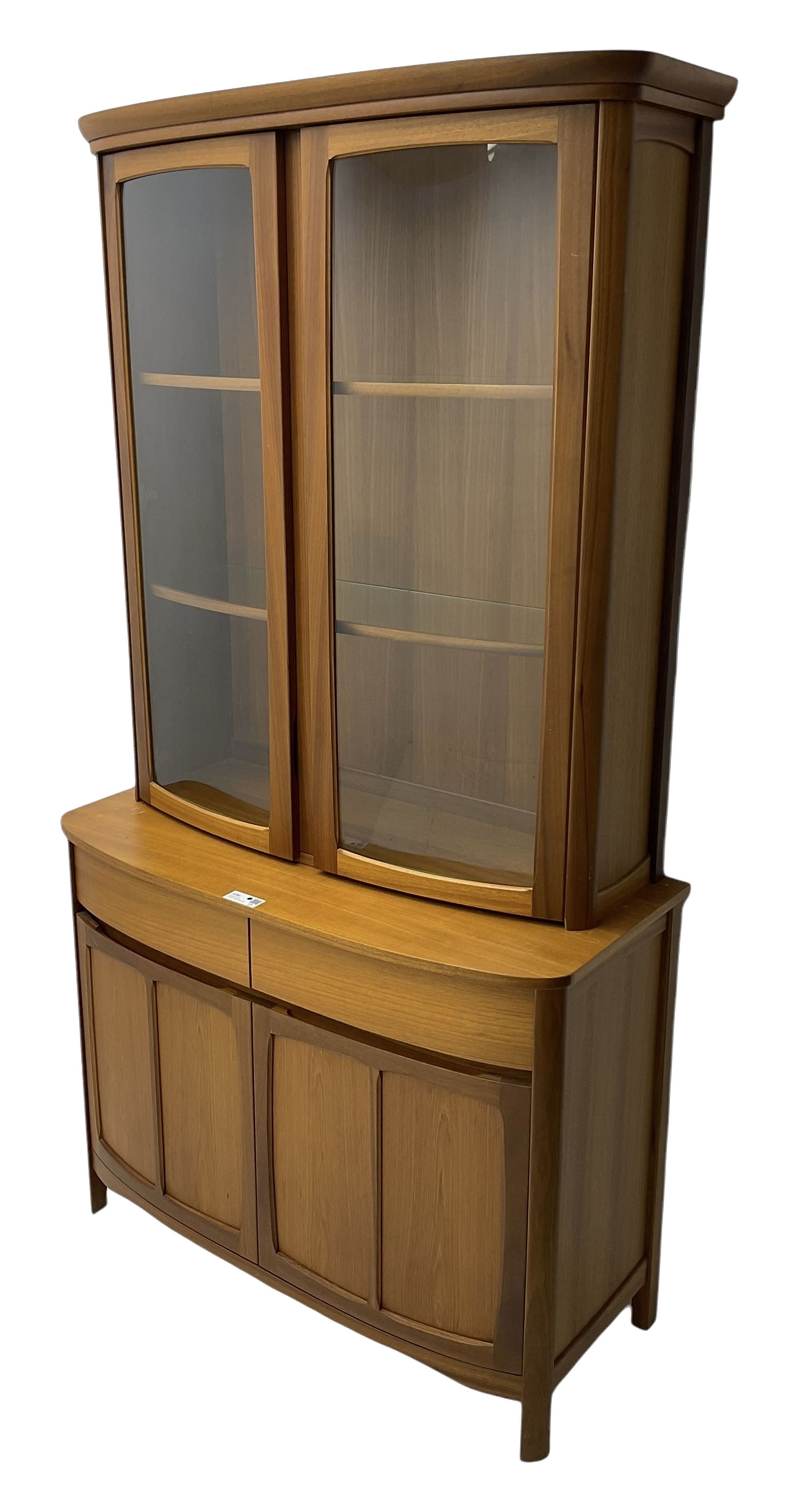 Nathan - teak wall display unit, raised display cabinet enclosed by two glazed doors, the lower section fitted with two drawers and double panelled cupboard 