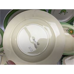 Clarice Cliff for Newport Pottery Corolla pattern tea and dinner wares, comprising triangular bowl, four side plates, two shallow bowls and teacup (a/f), together with a Clarice Cliff Wilkinson twin handled soup bowl and unassociated saucer both decorated with pink and yellow flowers, together with other mid century ceramics comprising Parrott and Company Coronet Ware, and Royal Staffordshire AJ. Wilkinson Ltd dinner wares