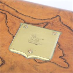 19th century walnut and brass bound games compendium box, painted to enhance the grain, of rectangular form, the hinged opening cover with rounded sides, central brass cartouche with engraved lion crest, and brass riveted straps, opening to reveal a red leather and blue silk lined compartmented interior, with fold-down games board, and lift-out tray containing playing cards, ebony turned dice towers, white and red stained bone draughts, and chess pieces, ivory dice, and ivory and ebony whist markers, and brass bezique board, cribbage board and markers, H15cm W32cm D24cm
This lot has been registered for sale under Section 10 of the APHA Ivory Act