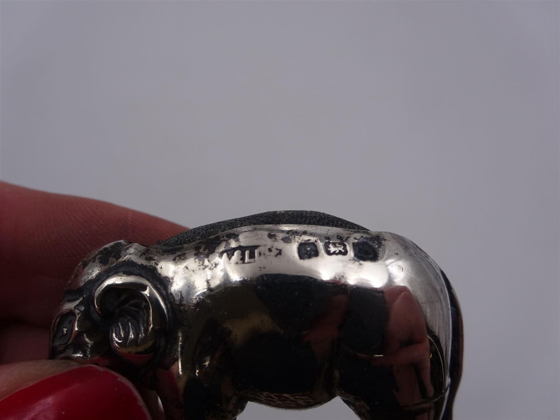 Edwardian silver mounted novelty pin cushion, in the form of an elephant, with cushioned back, hallmarked Birmingham 1906, maker's mark worn and indistinct, L4cm, H3.5cm