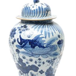 Pair of Chinese blue and white jars and covers, of baluster form, hand painted with fish and foliage, H50cm