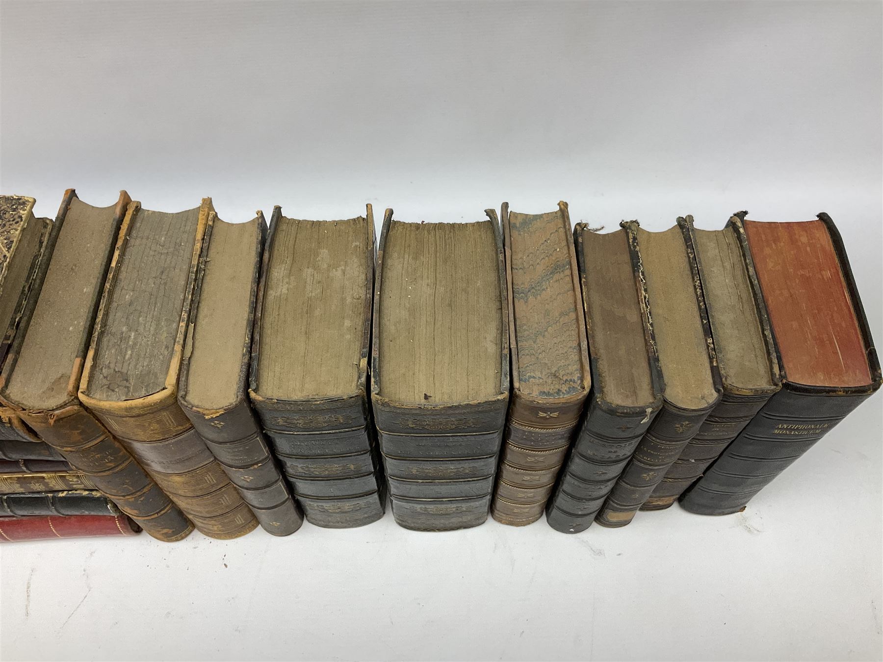 Eighteen 19th century leather bound books including Oeuvres Completes De Voltaire. 1827 Paris. Two volumes; Oeuvres De Pierre Corneille. 1892 Paris; Commentarium in Librum Geneseos Scripsit Thomas Josephus Lamy. 1883 Mechliniae; etc (18)