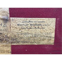 Leather shotgun case, the red baize lined interior with the trade labels of Westley Richards & Co., London, a brass plaque inscribed 'T Nevin, Mirfield, Yorkshire' to cover, with key, case to fit barrel 76cm (30 inches)  
