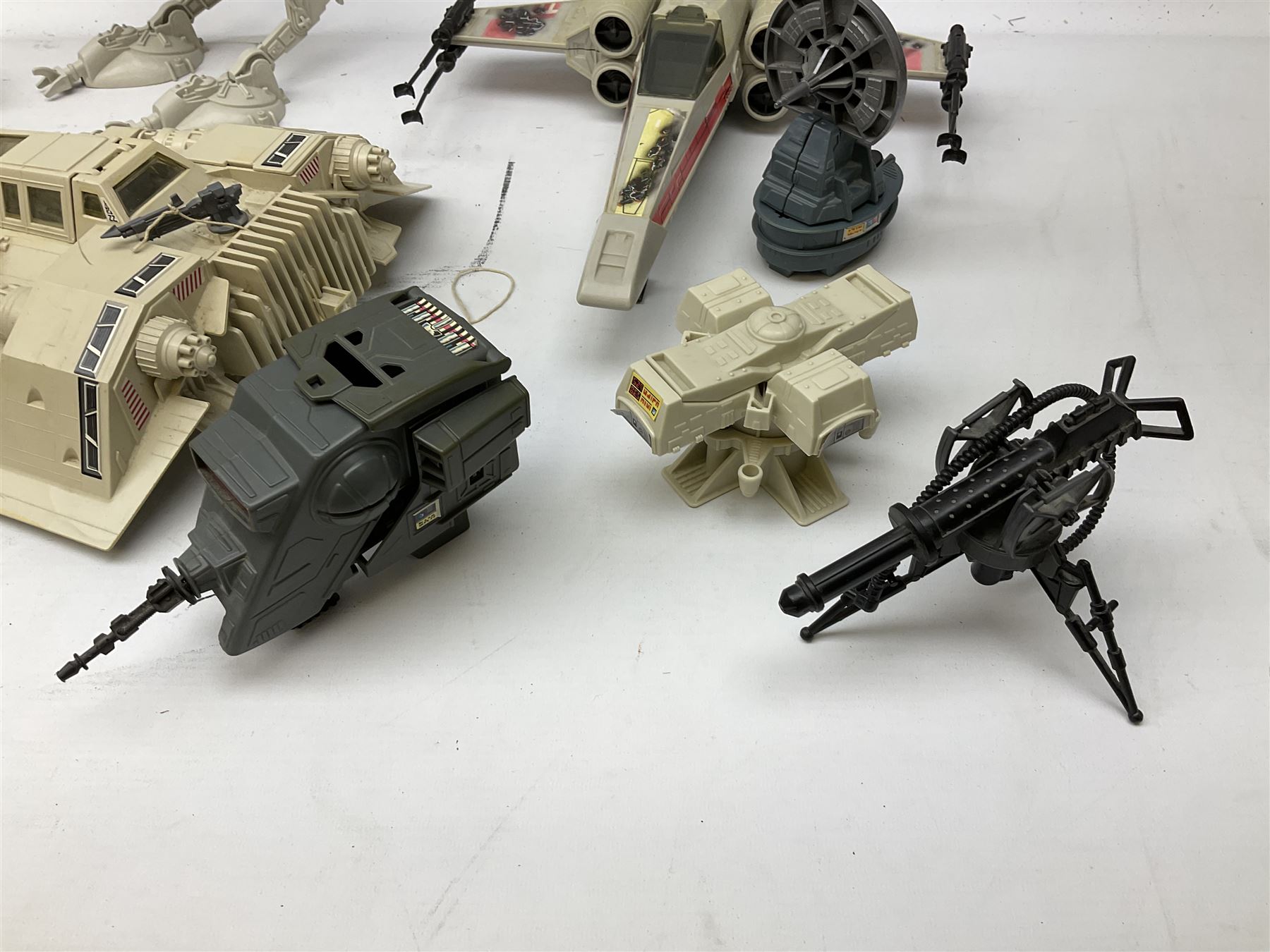 Star Wars - thirteen early 1980s vehicles/equipment including X-Wing Fighter; Snowspeeder; Slave 1 (Boba Fett's Spaceship); Scout Walker C7; Mobile Laser Cannon; Tripod Laser Cannon; Speeder Bike; Radar laser Cannon; two Vehicle Maintenance Energisers etc; all unboxed (13)