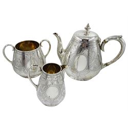 Victorian silver three piece baluster tea service, with bright cut decoration and cartouche by Martin, Hall & Co, London 1871/79, approx 40.5oz