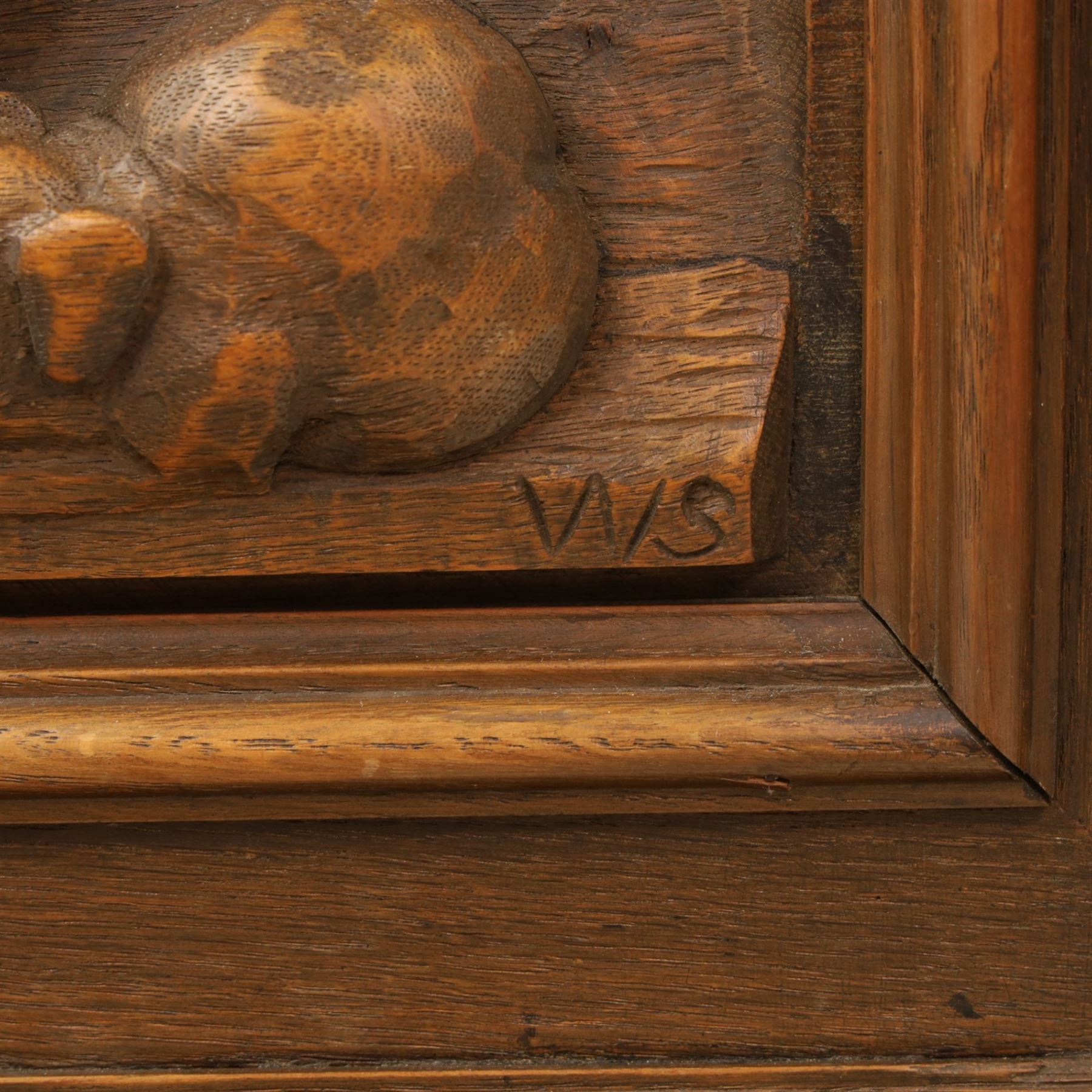 Carved oak coffer bench, rectangular moulded top above carved fall front, with figural, mask and foliate decoration, panelled sides, raised on turned bun feet with shaped lower apron