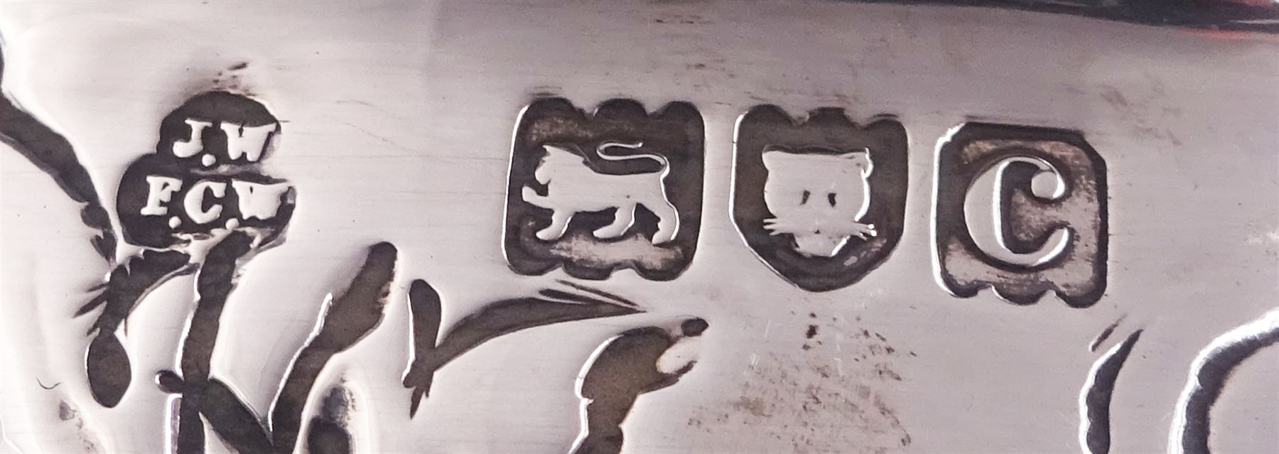 Late Victorian silver rose bowl, of circular form with embossed foliate and C scroll decoration, and engraved personal dedication, upon a part fluted spreading circular foot, hallmarked Wakely & Wheeler, London 1898, H11.5cm D18cm, approximate weight 11.67 ozt (363.2 grams)