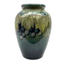 Moorcroft Grape and Leaf pattern baluster vase on green and blue ground, with impressed and painted mark beneath, H24cm