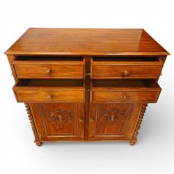 Victorian design rosewood side cabinet, the rectangular moulded top above four frieze drawers with turned wooden knob handles, over twin cupboard doors carved with foliate panels, flanked by barley twist uprights, upon turned bun feet