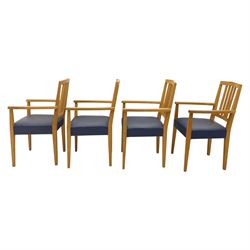 Modern twelve oak dining chairs including one 'Chairmans' chair, solid oak construction, slatted back and arm rests, blue leatherette padded seat, on tapered square supports 