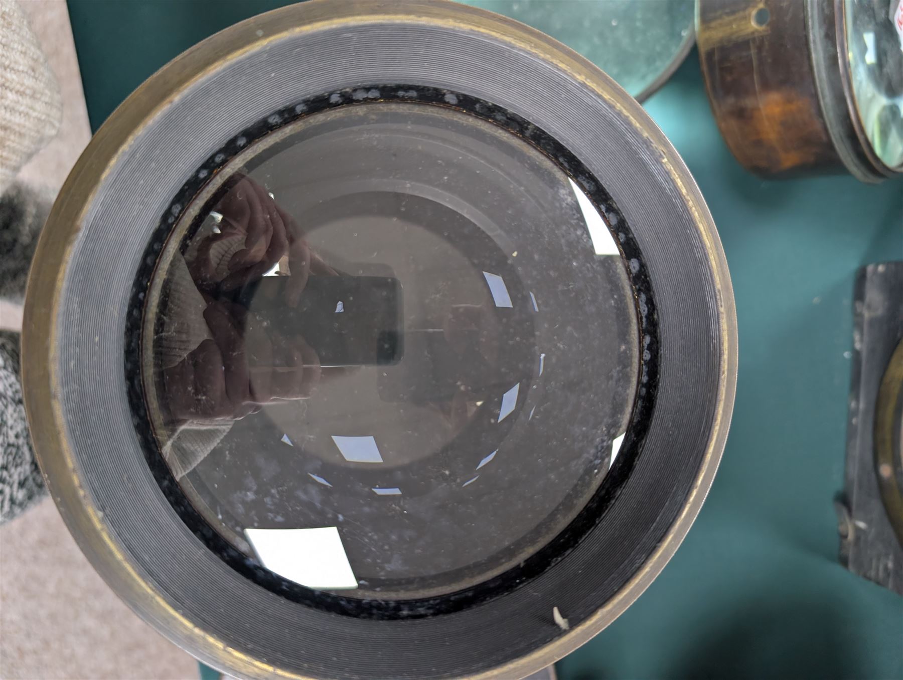 Late 19th century Voigtlander & Sohn large brass Euryscop lens no. 8 serial no. 31590, mounted to long black wooden box, with leather lens cover and seven brass Waterhouse stops, lens case D19cm